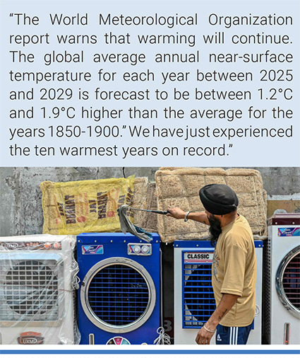 A vendor wipes dust off refrigerators displayed outside a shop as he waits for customers on a hot day in Amritsar, India. Photo: Narinder Nanu/AFP.
