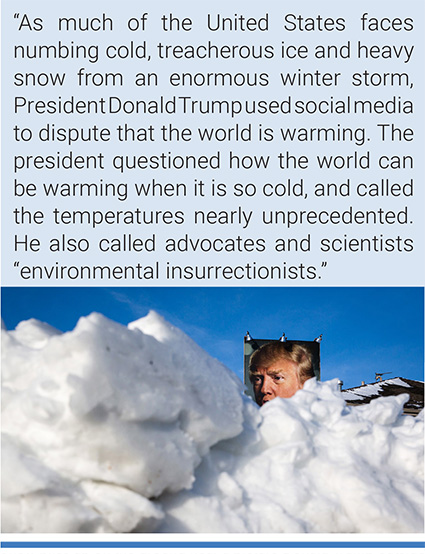 Snow piles up on the ground near a picture Donald Trump outside a home in West Des Moines, Iowa. Photo: Scott Morgan/Reuters.